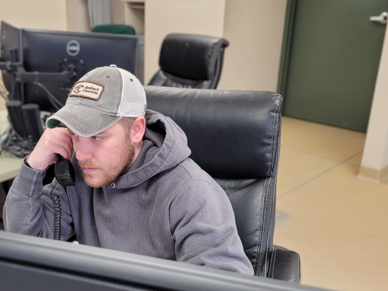 A concrete dispatcher on the phone with a customer